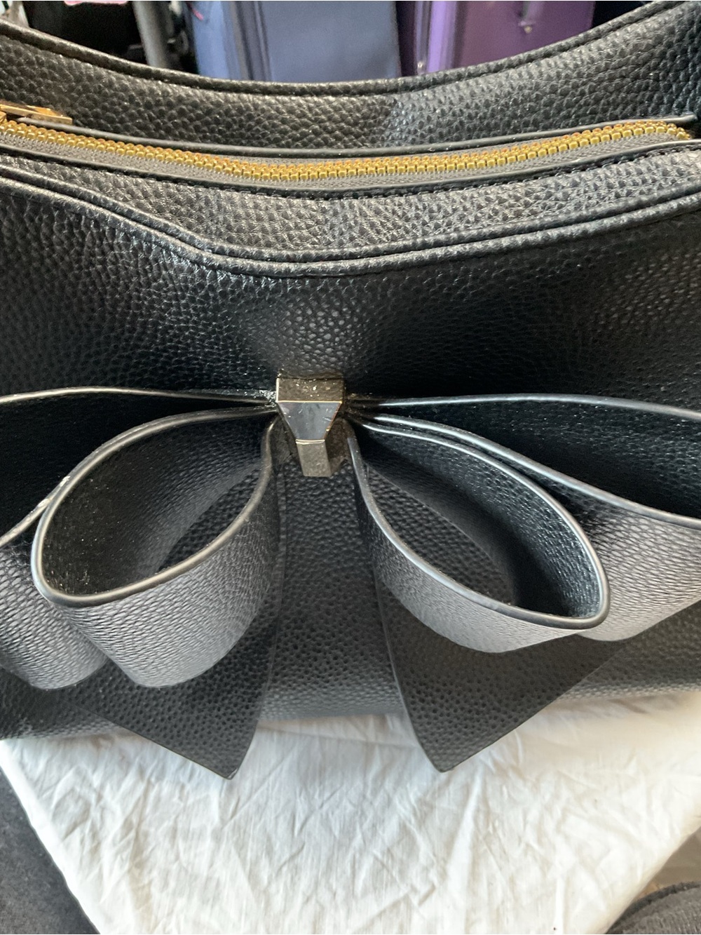 Black Bow-Front Shoulder Bag with Gold Zip Accent